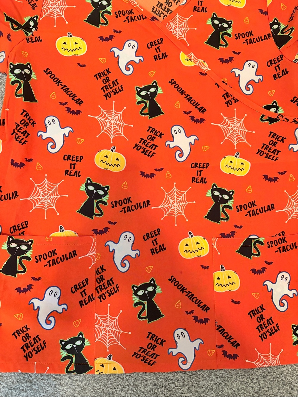 Lot of two women’s medium orange Halloween scrub tops